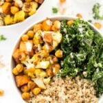 Curry Roasted Vegetable Quinoa bowls with cauliflower, sweet potatoes, chickpeas, kale and a creamy tahini dressing!