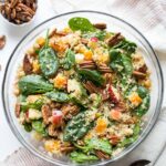 A simple fall quinoa salad packed with roasted butternut squash, chopped apples, pecan and spinach!