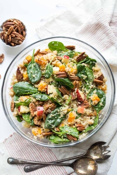 Overhead view of butternut squash quinoa salad in glass bowl
