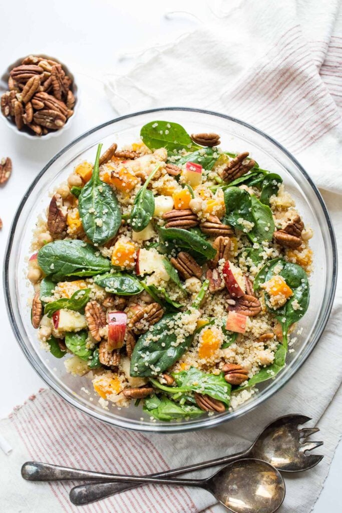 Overhead view of butternut squash quinoa salad in glass bowl