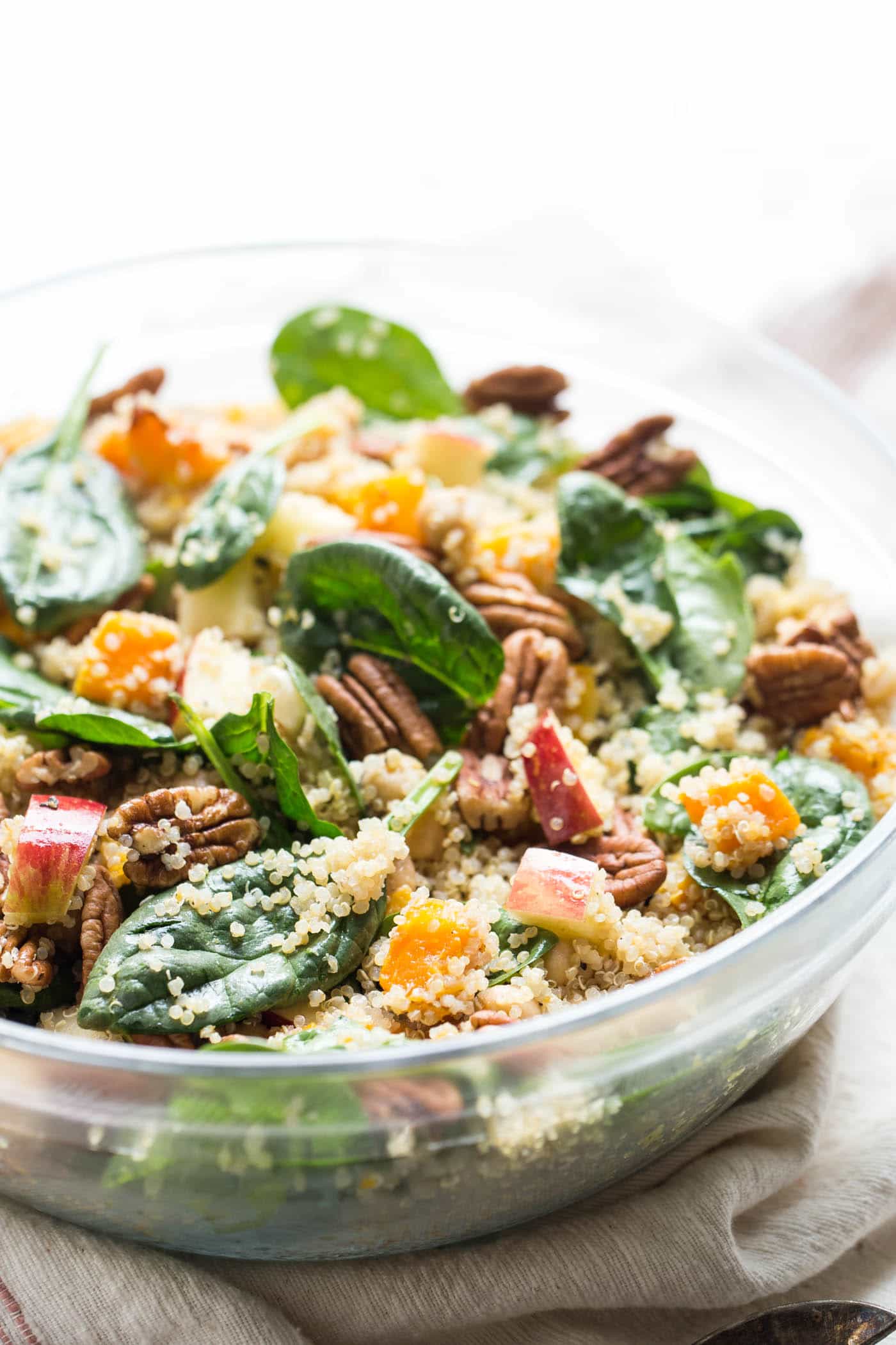 Quinoa butternut squash salad in a glass bowl