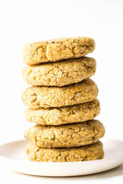 Simple Vegan Quinoa Burgers dressed in a dreamy turmeric-tahini sauce!