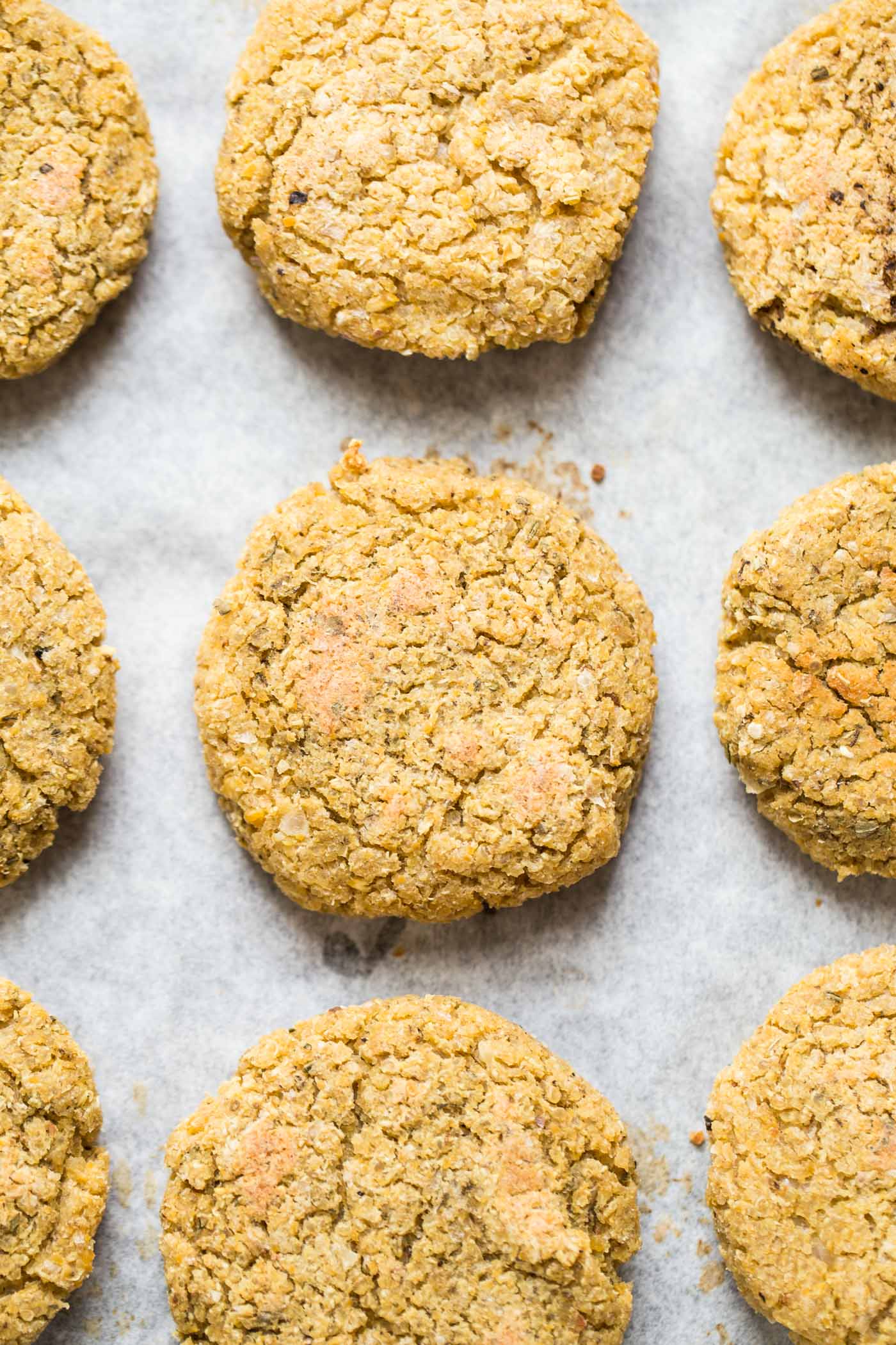 Simple Vegan Quinoa Burgers dressed in a dreamy turmeric-tahini sauce!