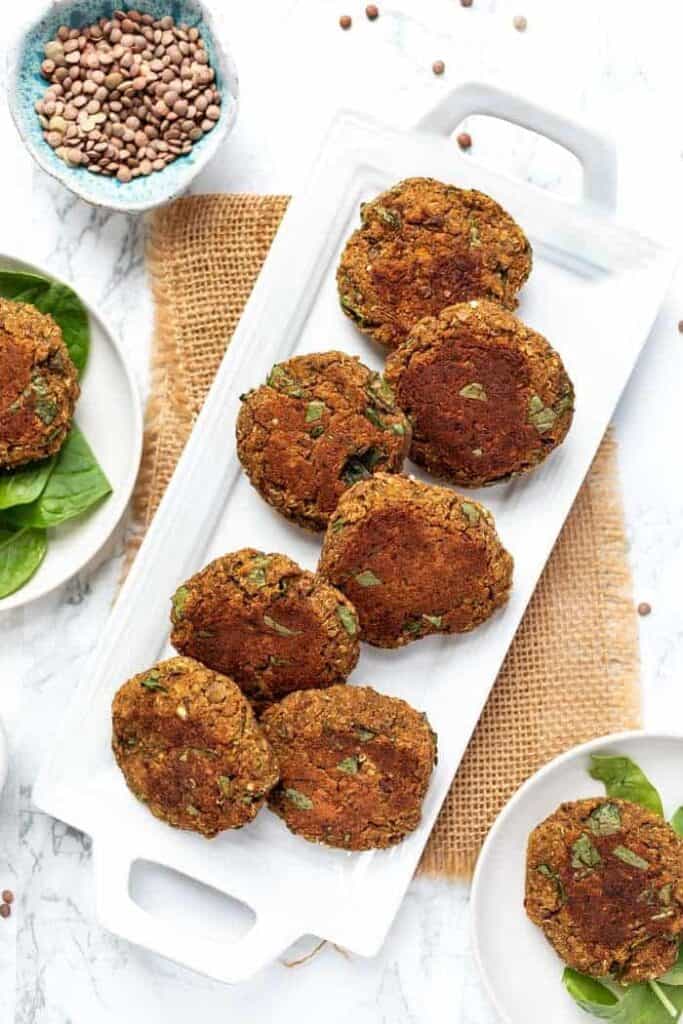 Overhead view of lentil patties served on a platter.