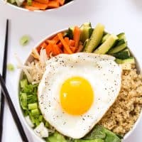This simple Quinoa Bibimbap is made with steamed veggies and topped with a fried egg for an easy, delicious and meatless meal!