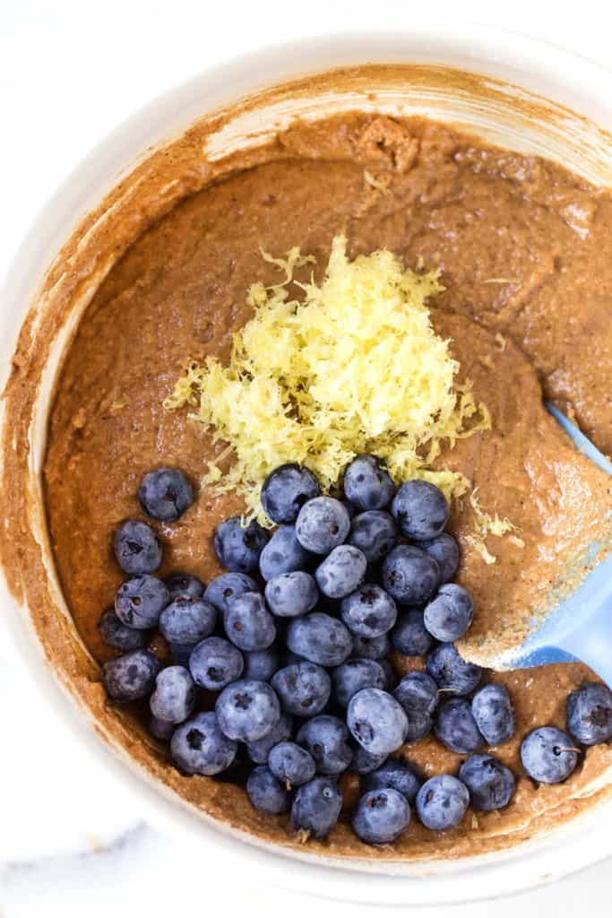 Loaded with juicy fruit and topped with the best pecan crumble, this gluten-free lemon blueberry coffee cake is almost too good to be true. Adding lemon zest and blueberries to gluten-free coffee cake batter.