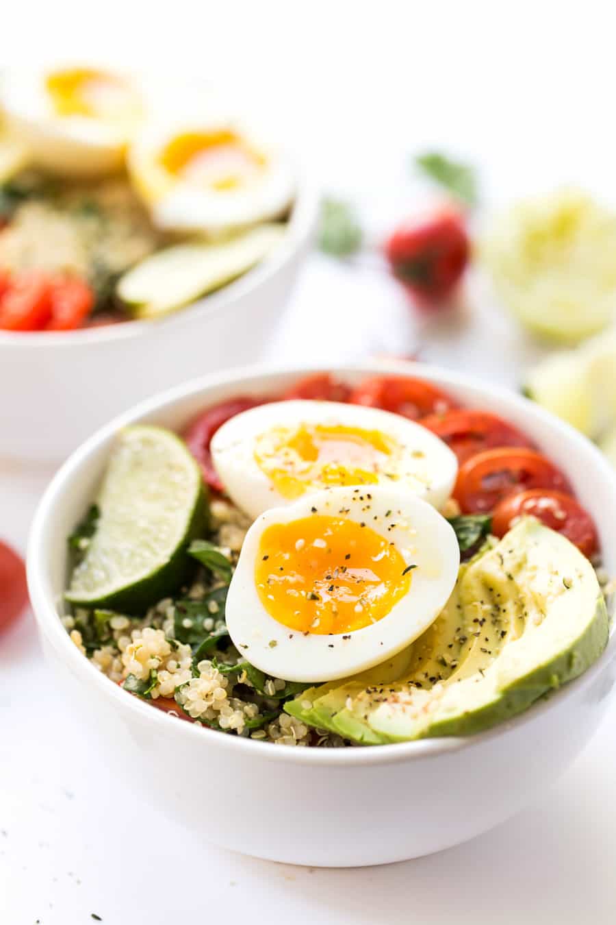 A mexican inspired Quinoa Breakfast Bowl with tomato, avocado and soft boil eggs!