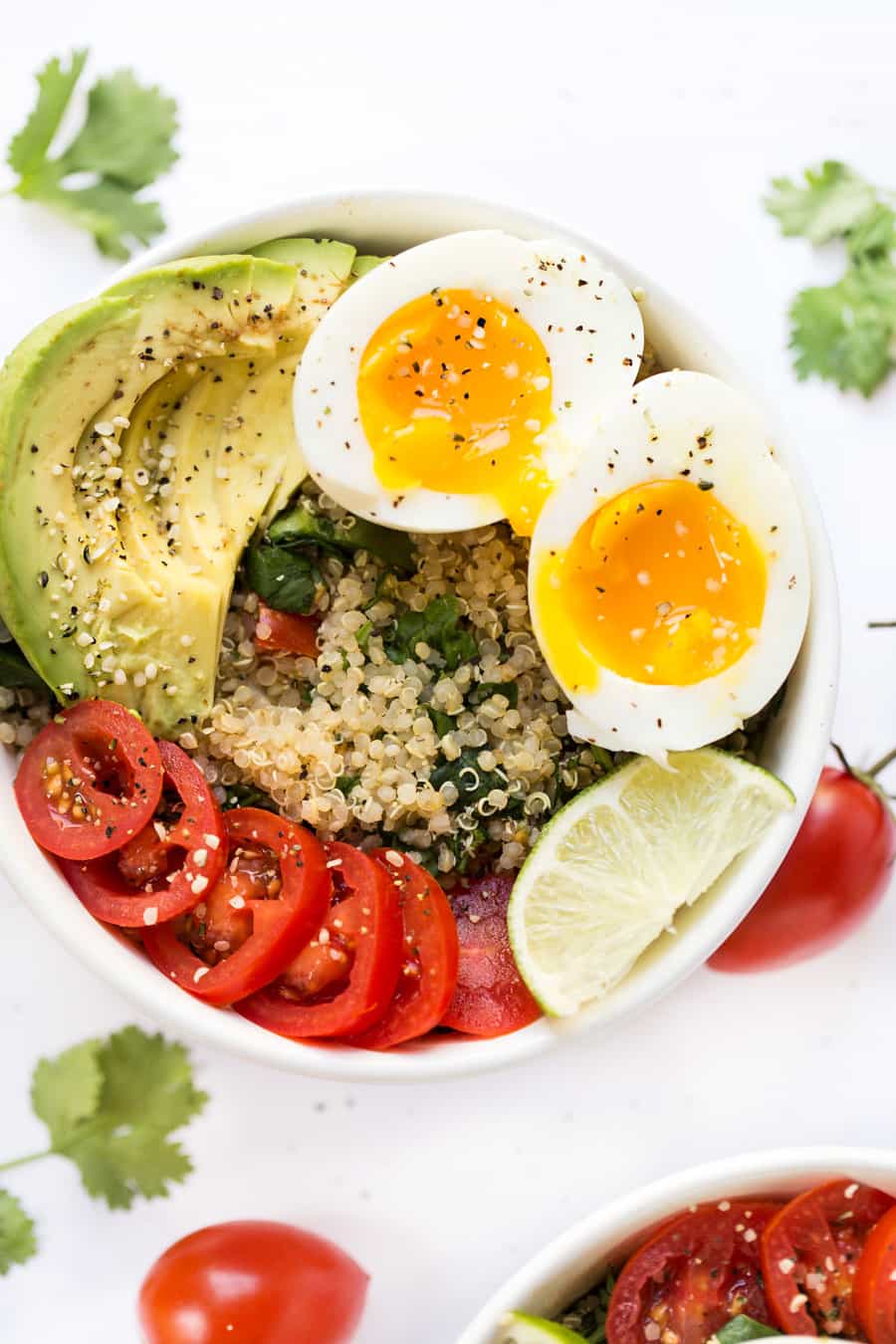Mexican Quinoa Breakfast Bowls -- with tomato, avocado, soft boiled eggs and cilantro-lime quinoa!