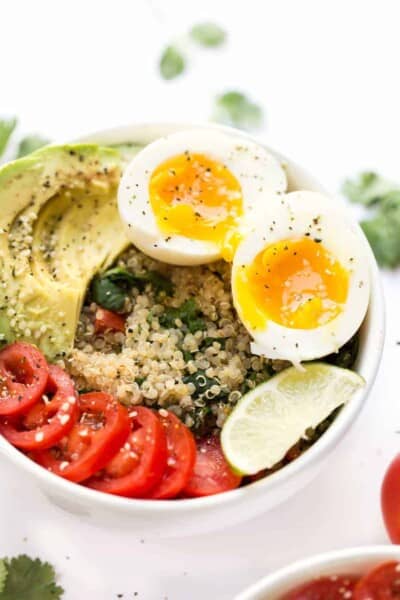 Mexican Quinoa Breakfast Bowls -- with tomato, avocado, soft boiled eggs and cilantro-lime quinoa!