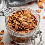 A jar of chili roasted pumpkin seeds