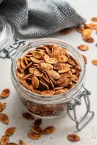 A jar of chili roasted pumpkin seeds