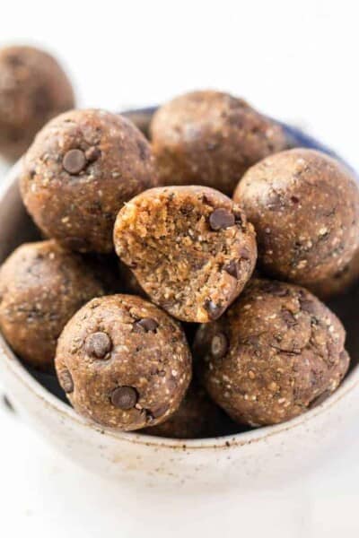 A bowl of healthy peanut butter energy balls with oats and chocolate chips