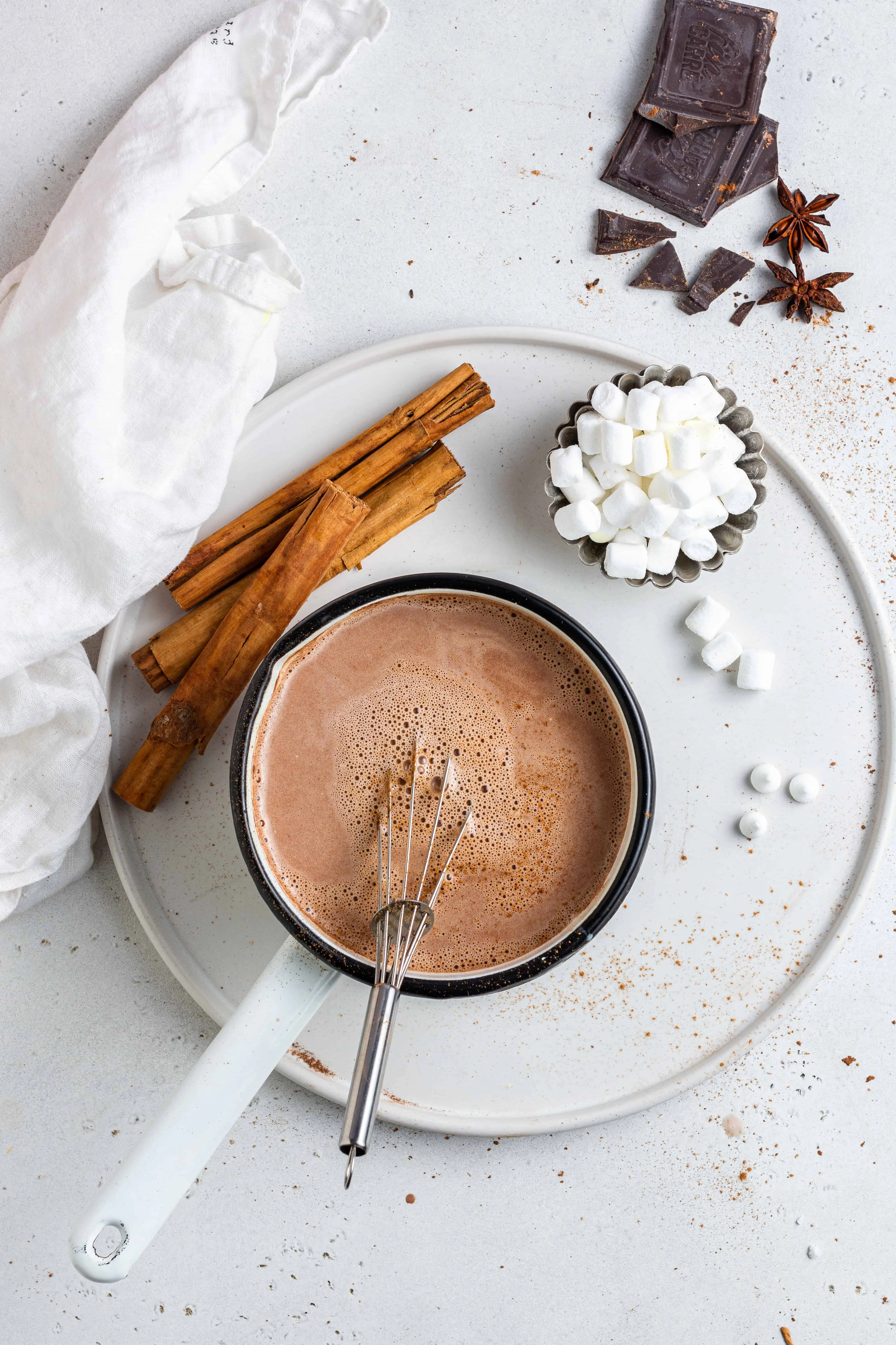 how to make vegan hot chocolate with a marshmallows, cinnamon stick and white pot