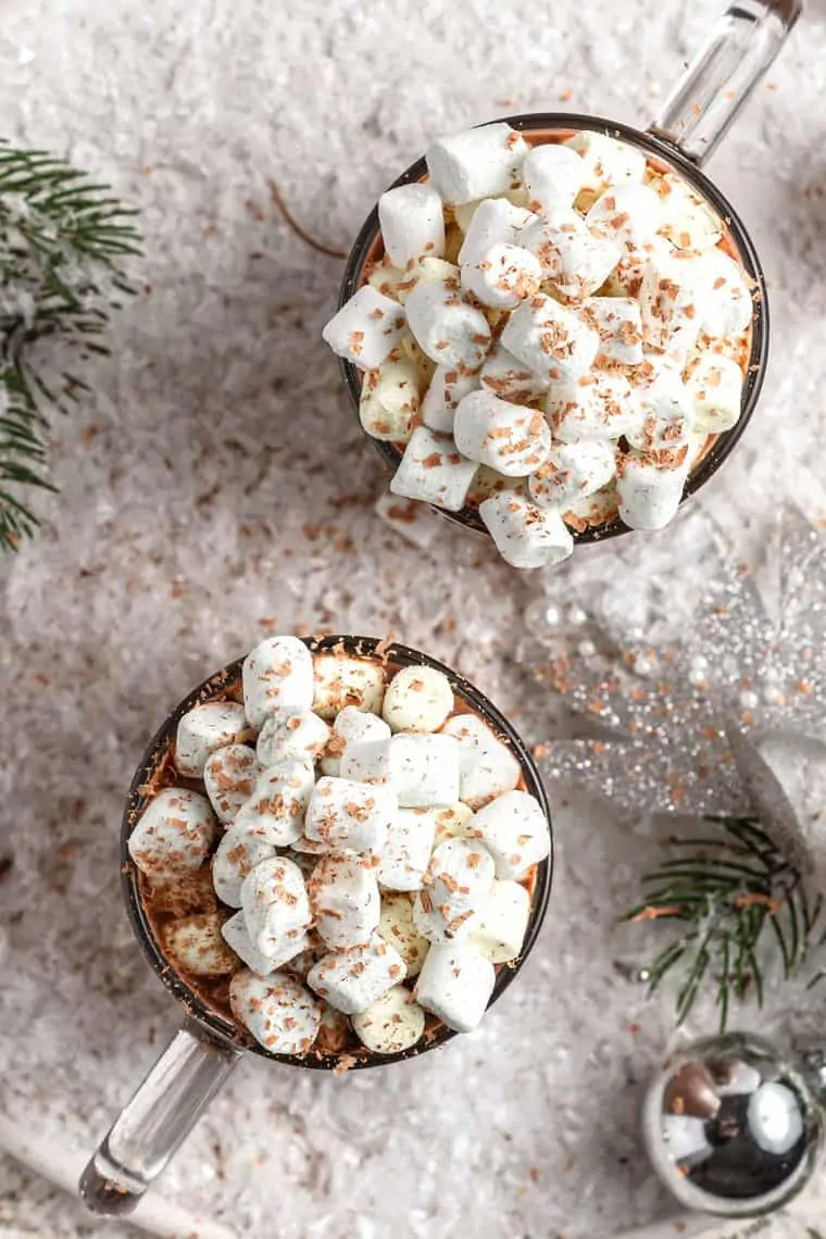 two cups of vegan hot chocolate with mini marshmallows