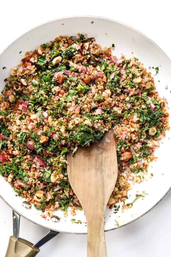 a kale and quinoa salad with lemon, onion and hazelnuts