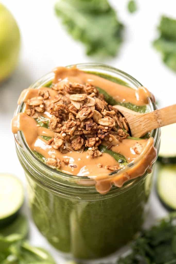 green apple smoothie with peanut butter and granola