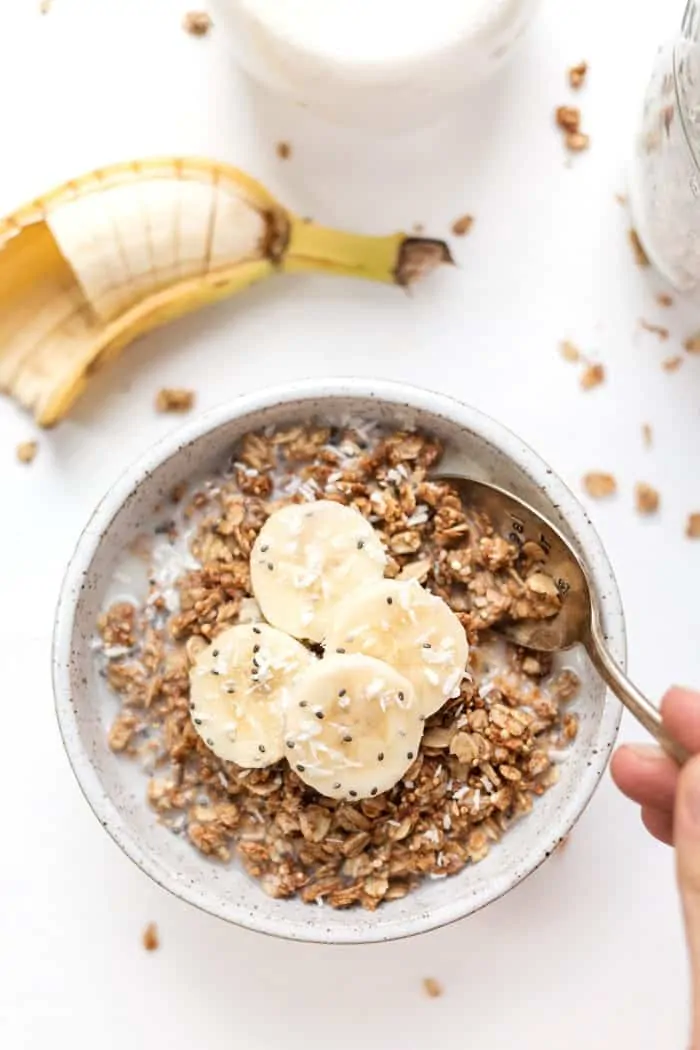 peanut butter banana quinoa granola recipe with sliced bananas on top