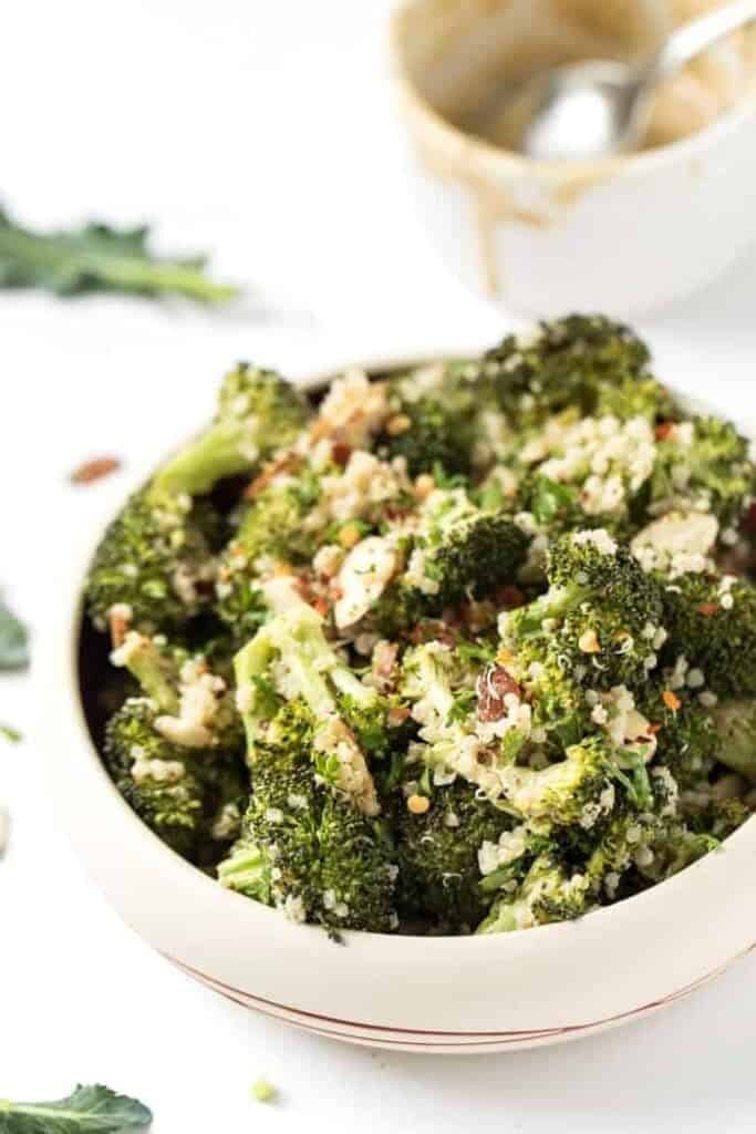 creamy vegan broccoli quinoa salad with sliced almonds