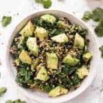 Overhead view of kale quinoa salad in a bowl.