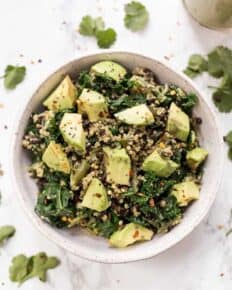 Overhead view of kale quinoa salad in a bowl.