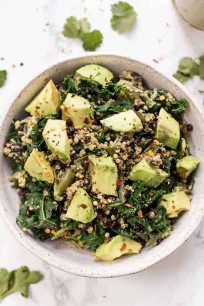 Overhead view of kale quinoa salad in a bowl.