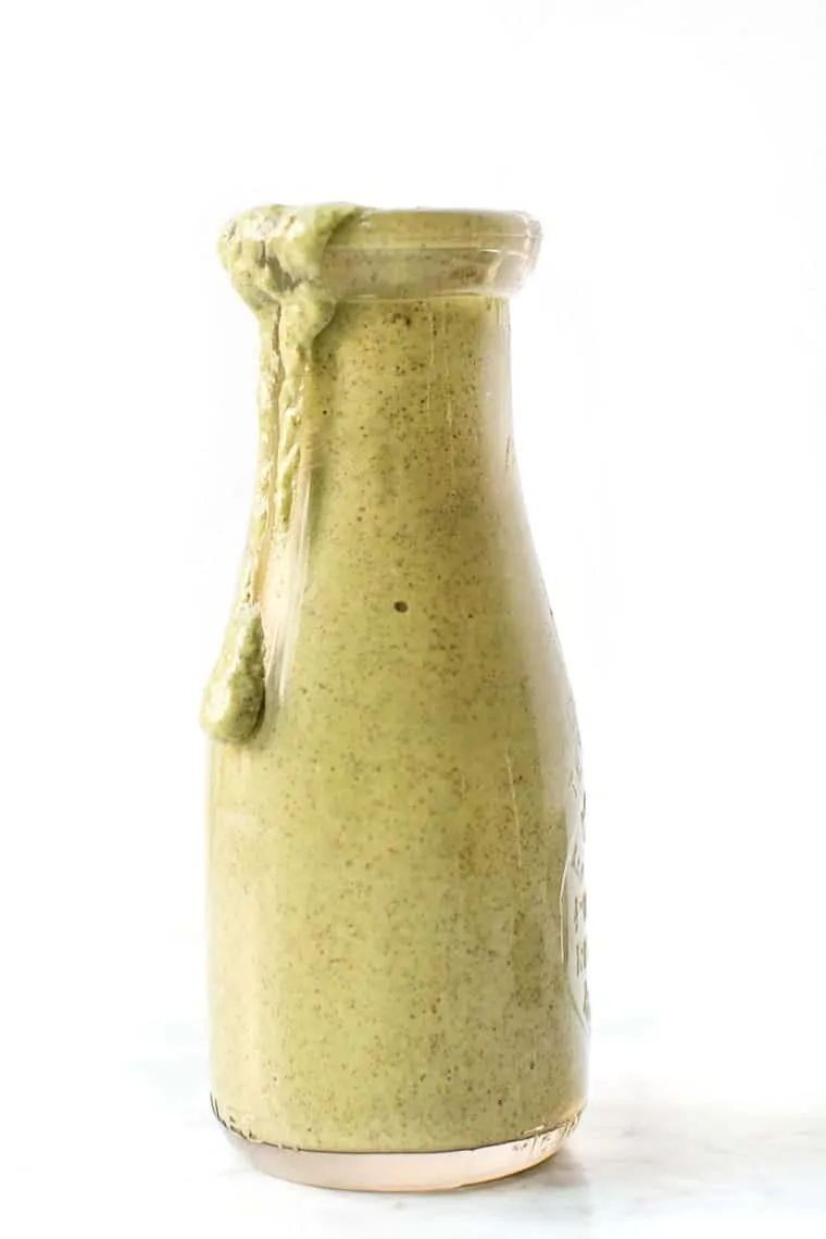 A jar of vegan cilantro lime salad dressing.