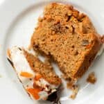 Slice of gluten-free carrot cake on plate with fork