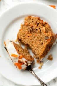 Slice of gluten-free carrot cake on plate with fork