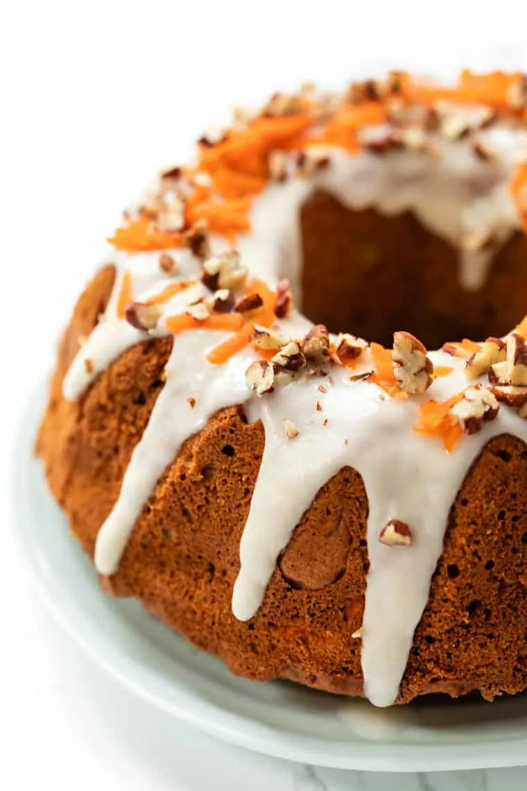 This gluten-free carrot cake recipe has the moist texture and spiced flavor of the original, but it’s made using almond and quinoa flours! Gluten-free carrot cake with icing
