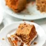 Slice of gluten-free carrot cake on plate with fork