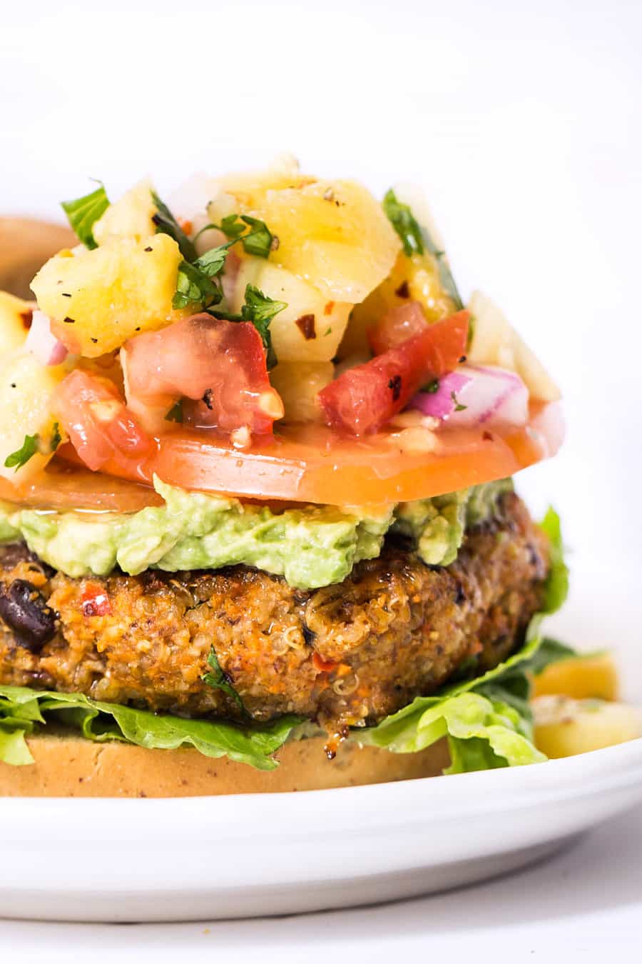 TEX MEX QUINOA BURGERS with corn, black beans and topped with a delicious pineapple salsa!