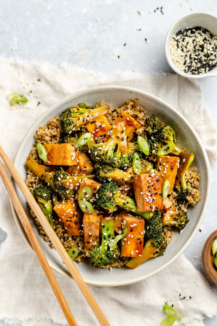 Tofu and broccoli stir fry with quinoa and soy sauce