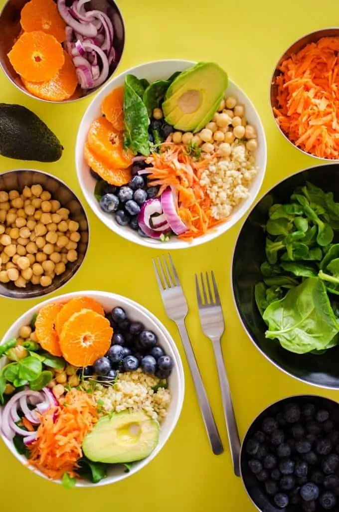 This 15 Minute Buddha Bowl recipe is a balanced, healthy lunch or dinner meal that comes together in no time! It’s a flavorful combo of healthy grains (bulgur, quinoa, couscous, or brown rice), chickpeas, fruit and avocado with a creamy, citrusy yogurt salad dressing.