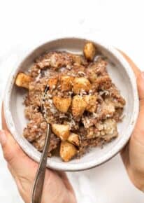 cinnamon apple breakfast quinoa recipe with apples and coconut on top