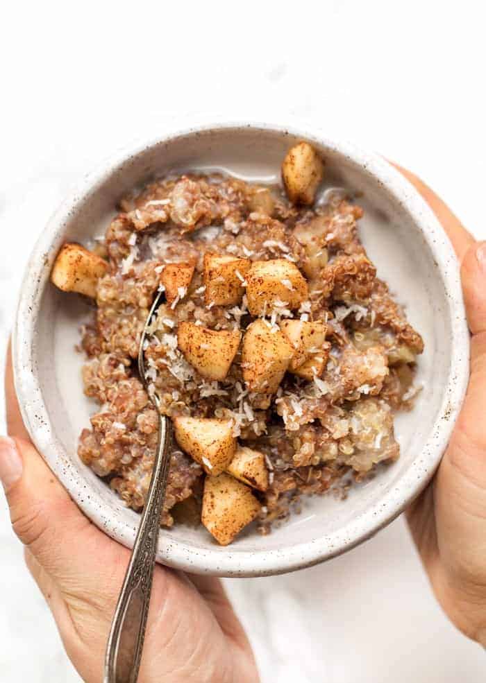 cinnamon apple breakfast quinoa recipe with apples and coconut on top