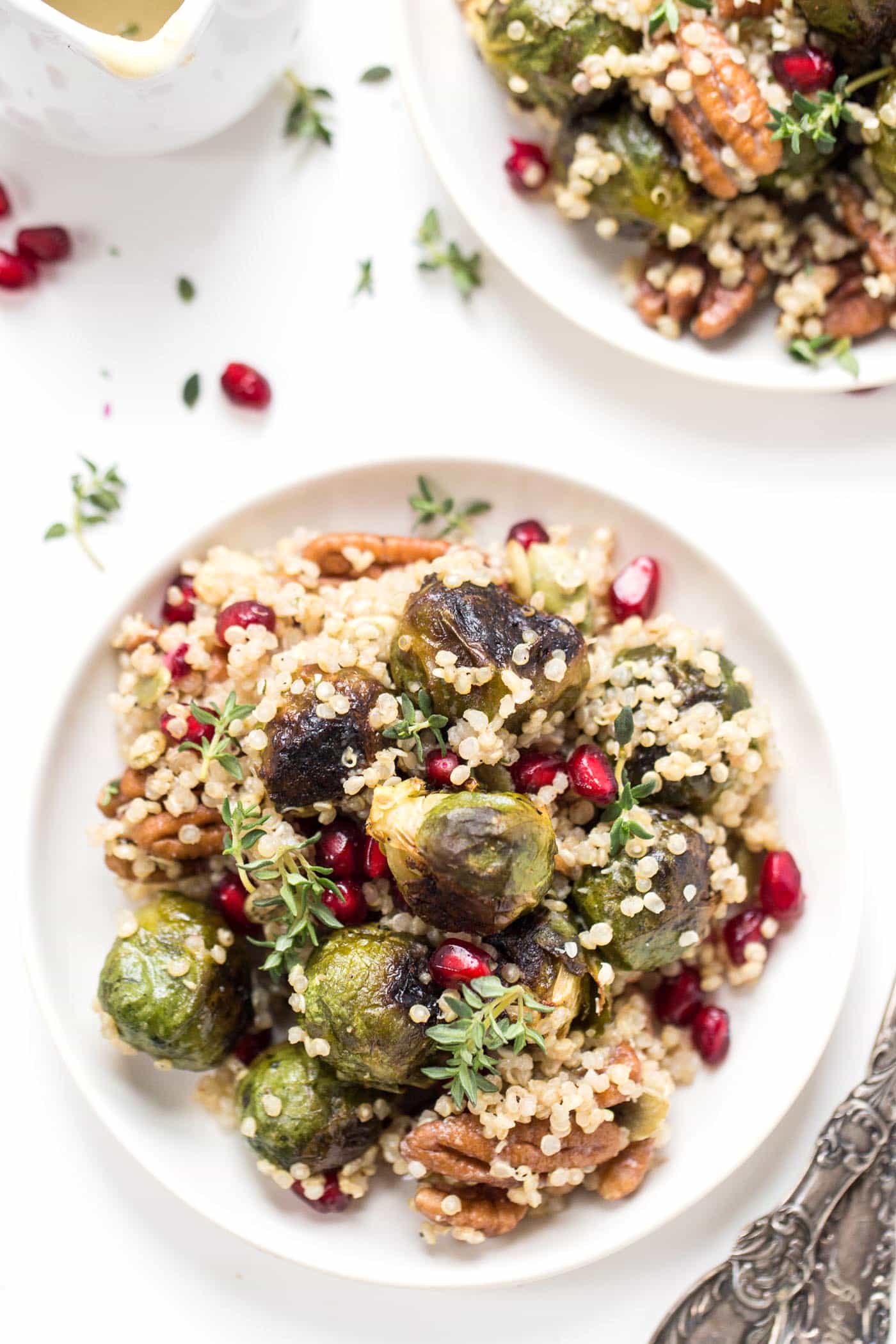 Roasted Brussels Sprout Quinoa Salad with pomegranates, pecans and a bright, tangy dressing!