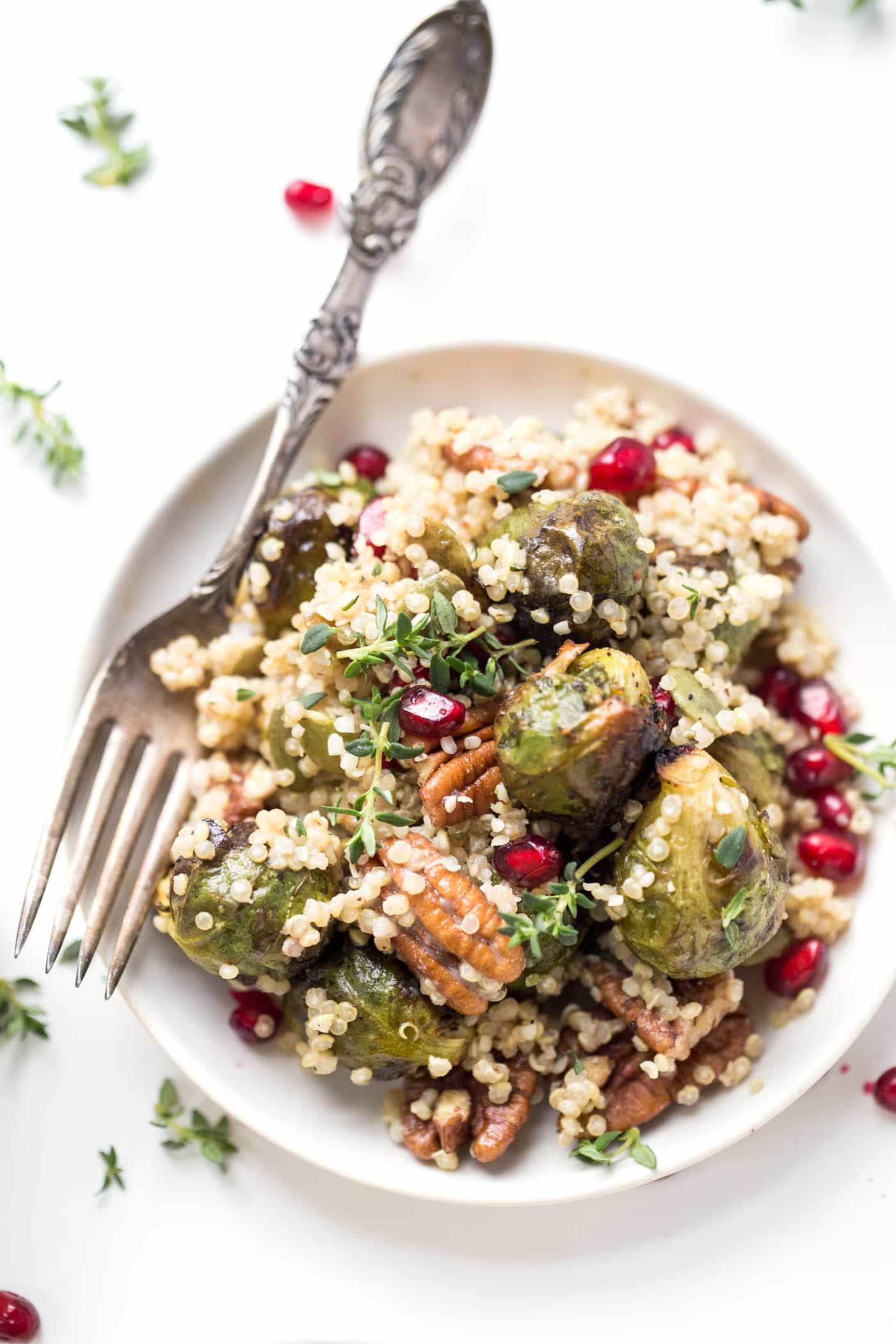 This AMAZING Roasted Brussels Sprout Quinoa Salad is the perfect side dish for your holiday feast. Simple, pretty, and oh so flavorful!