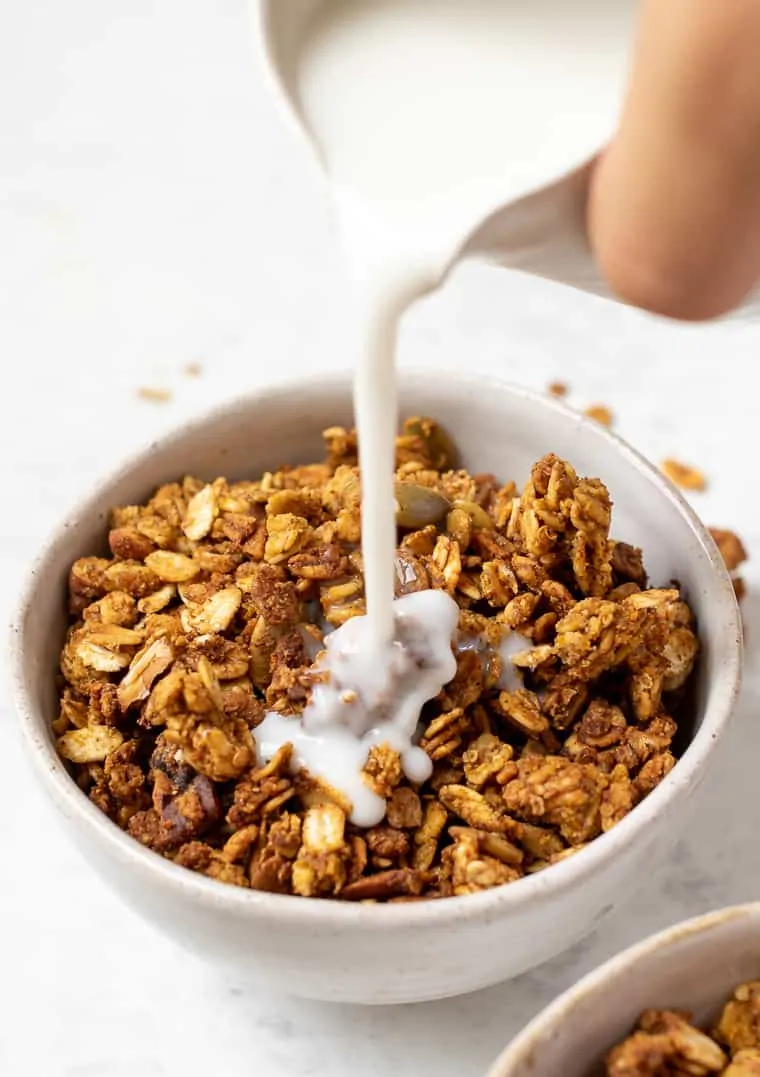 Pouring Milk Over Pumpkin Granola