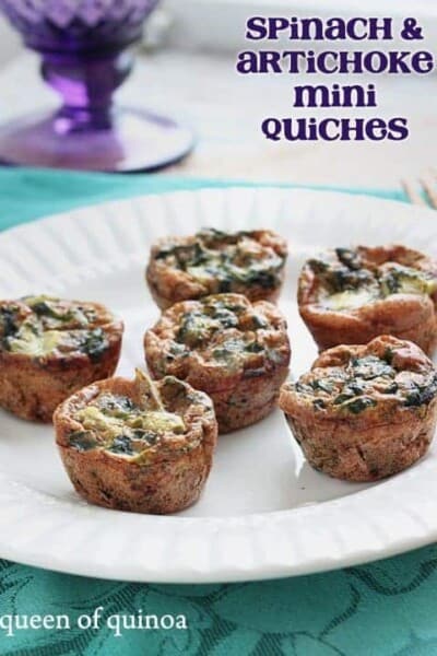 Spinach and artichoke mini quiches on a plate.