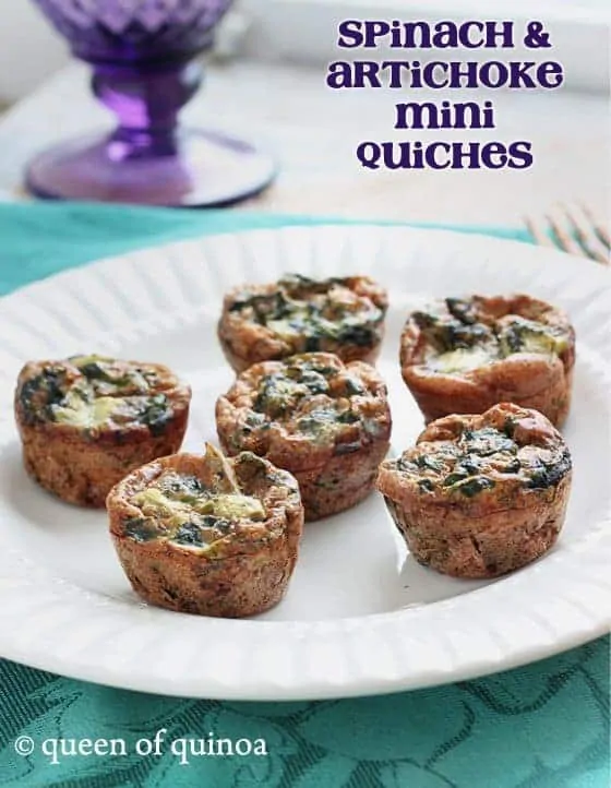 Spinach and artichoke mini quiches on a plate.
