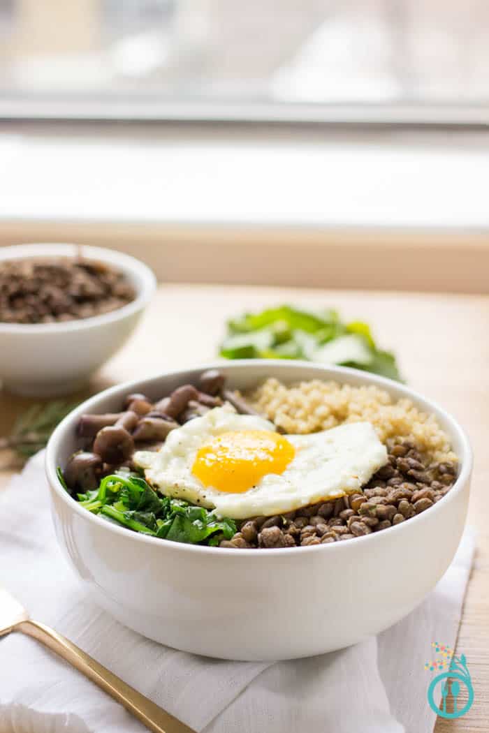 A warm and comforting QUINOA BOWL with hearty French Lentils and flavor packed mushrooms. All topped with a perfect fried egg on top!
