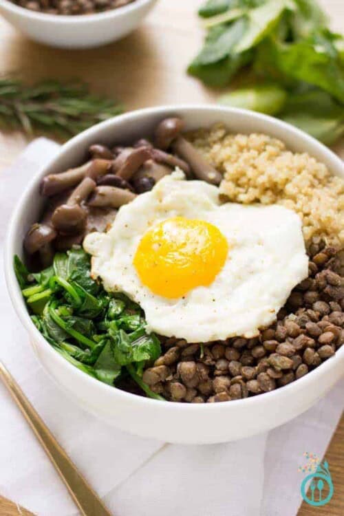 A warm and comforting QUINOA BOWL with hearty French Lentils and flavor packed mushrooms. All topped with a perfect fried egg on top!