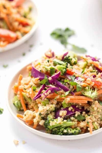 Bowl of Thai quinoa salad with veggies and almond butter dressing