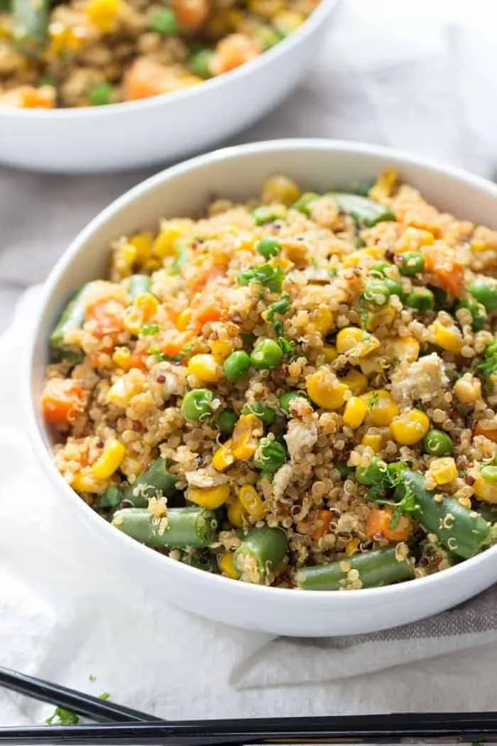 Super Easy Vegetable Quinoa Fried Rice that's made in less than 10 minutes and uses only 8 ingredients! (it's also gluten-free + vegetarian)