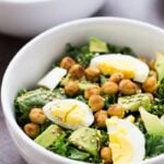 Totally Addicting Vegetarian Kale Salad with crispy chickpeas, hard boiled eggs and toasted quinoa