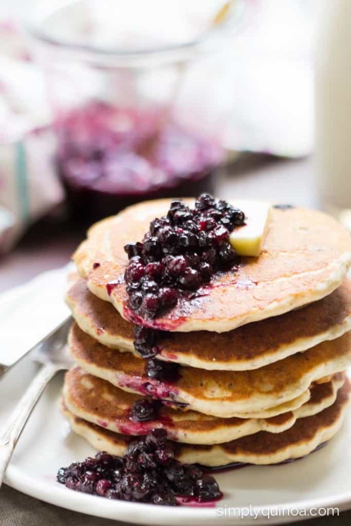 These Lemon Blueberry Quinoa Pancakes are gluten-free + vegan and are topped with an amazing blueberry sauce! | www.simplyquinoa.com
