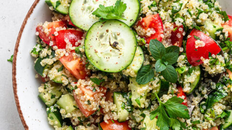overhead of white bowl with quinoa tabbouleh salad on top