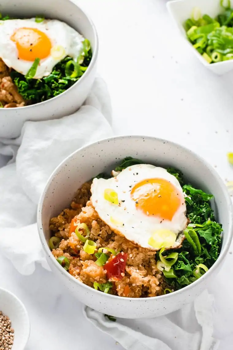 a simple kimchi quinoa bowl recipe with kale and fried egg