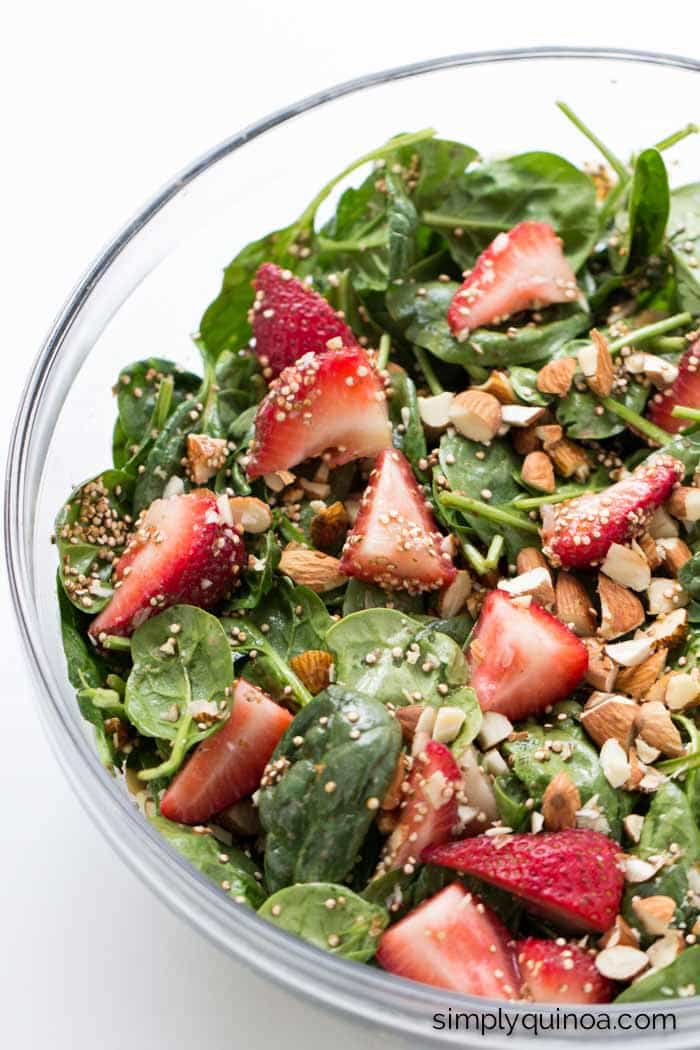 strawberry spinach salad with roasted quinoa and chopped almonds