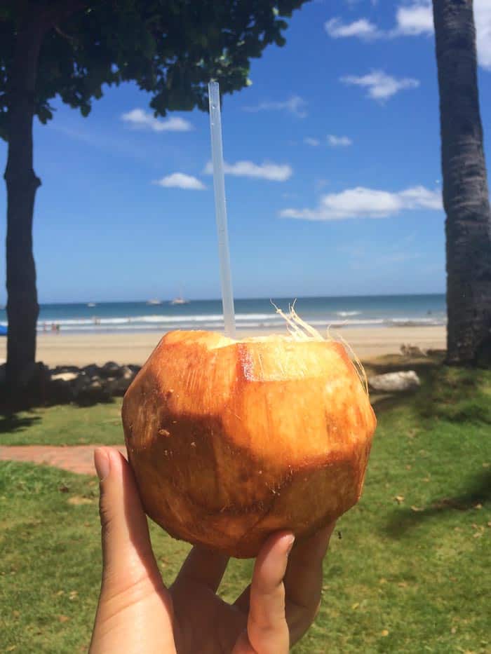 Drinking fresh coconut water in Tamarindo, Costa Rica | www.simplyquinoa.com